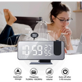 Black mirror led projection digital alarm clock in sleek silver and black displays time temperature and humidity on led screen