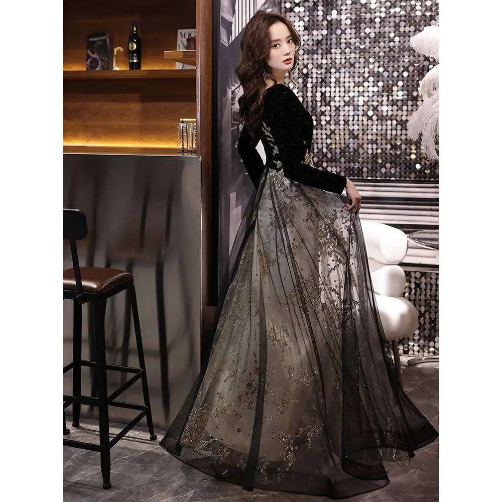 Elegant black moderator long sleeve annual party dress with black and gold embroidery velvet bodice and sheer tulle skirt