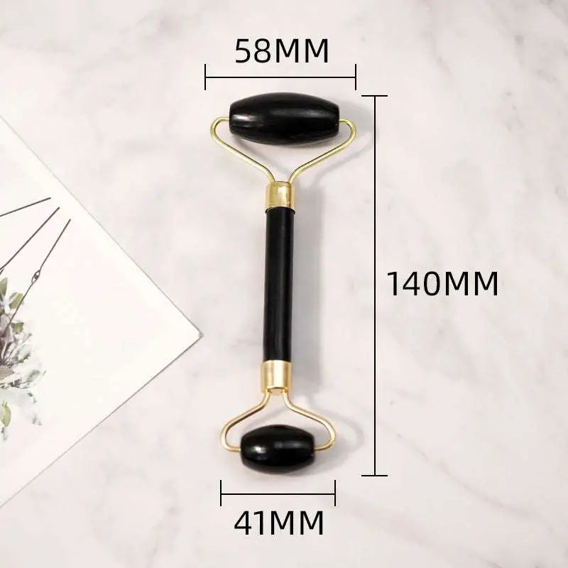 Black obsidian beauty face care massage jade roller with black onyx stone and gold-toned metal handles 140mm length