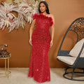 A shimmering red sequined mermaid gown with ruched bodice and feather stitching sequin details on the shoulders