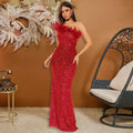 A shimmering red sequined evening dress with black paillette feather stitching sequin details and feathered shoulder accent