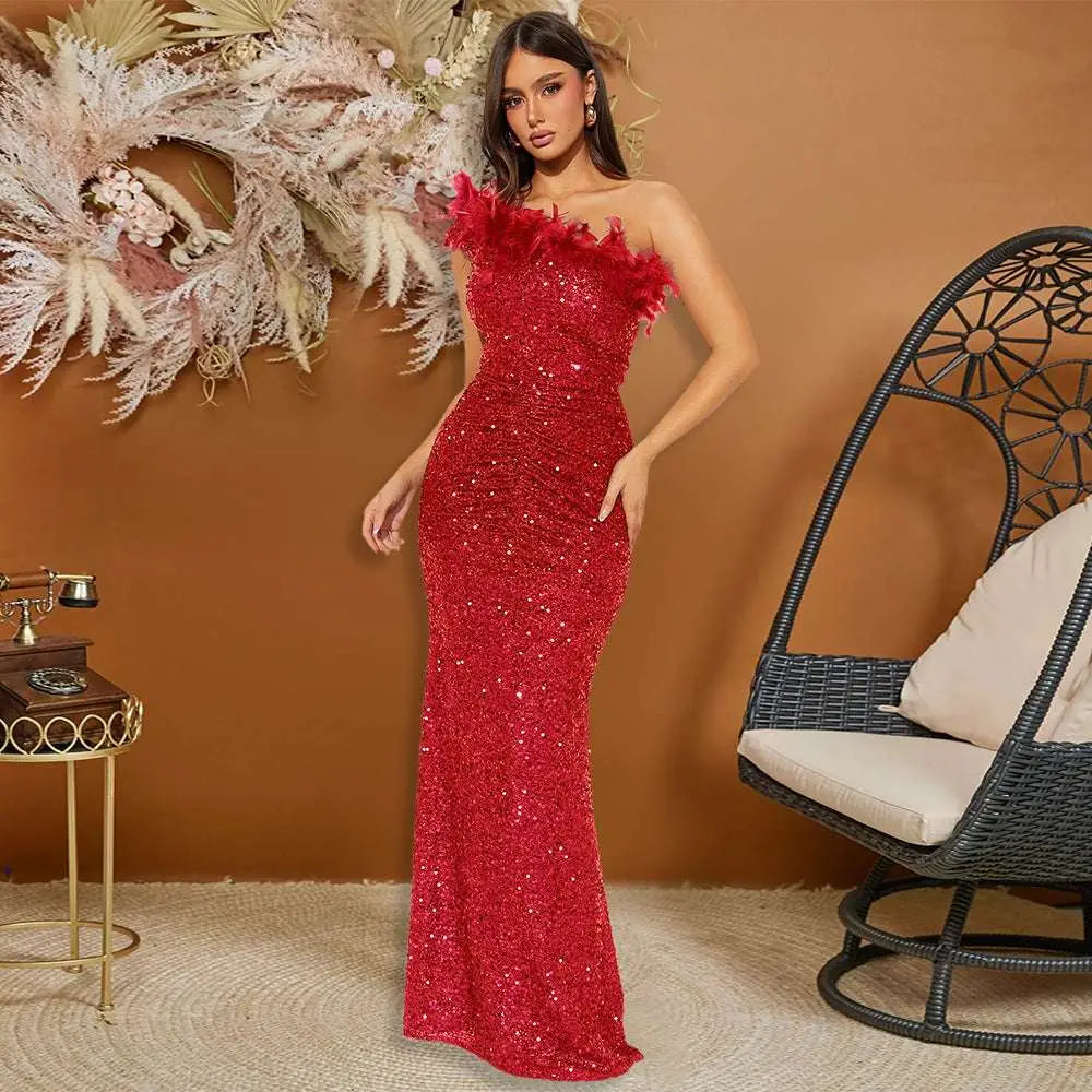 A shimmering red sequined evening dress with black paillette feather stitching sequin details and feathered shoulder accent
