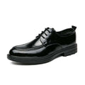 Black patent leather horsebit oxford shoe with glossy finish and textured rubber sole for male fashion formal wear