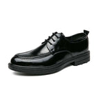 Black patent leather horsebit oxford shoe with glossy finish and textured rubber sole for male fashion formal wear