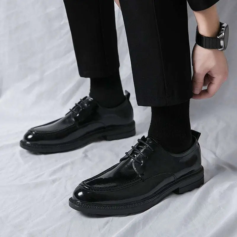 Black patent leather horsebit loafers male with glossy finish and thick soles ideal for male fashion formal wear