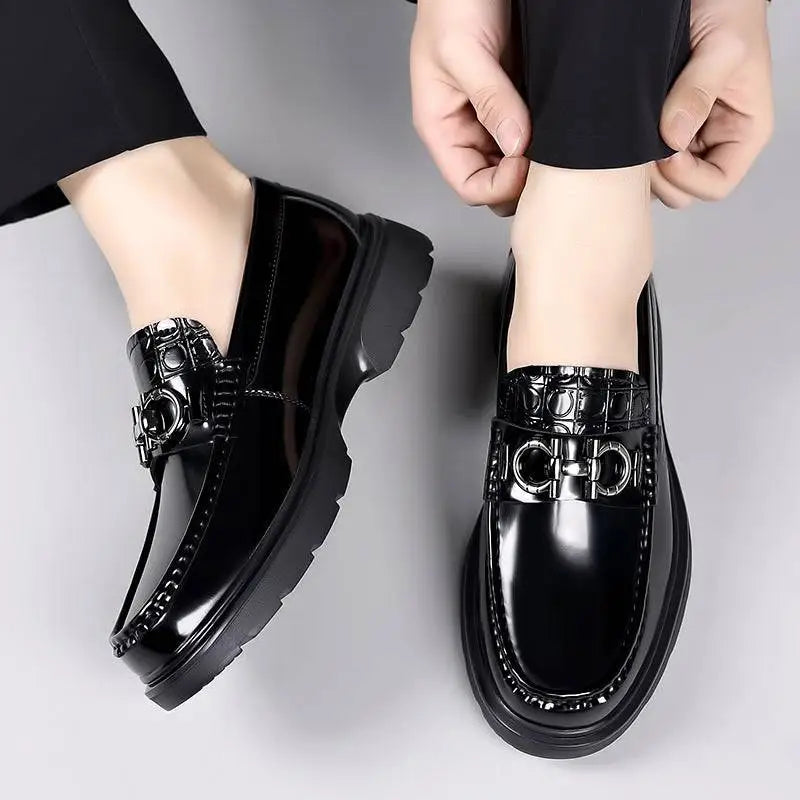 Black patent horsebit platform retro casual shoes with glossy finish and embossed circular pattern on side