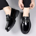 Black patent leather retro casual shoes with glossy finish and prominent silver horsebit buckle platform detailing