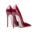 Burgundy patent leather high-heeled pumps with sleek stiletto pointed toe and slender patent stiletto pointed heel