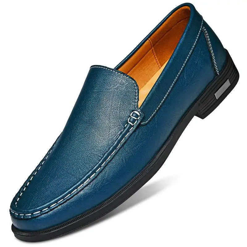 Deep blue leather male slip-on loafer with white stitching and black rubber sole offering superior comfort