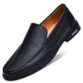 Black perforated leather slip-on loafer with tan interior lining and subtle stitching offering superior comfort leather male shoes
