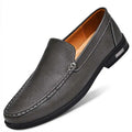 Black perforated leather slip-on loafer with contrasting white stitching and superior comfort for men