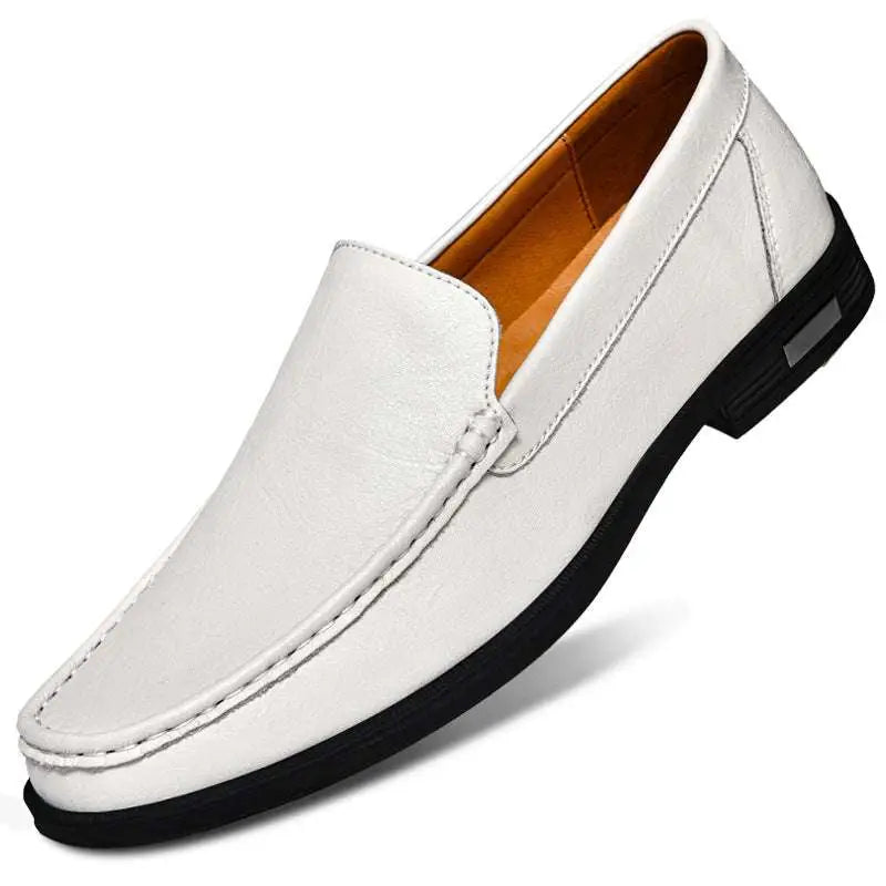 White leather slip-on loafer with black rubber sole and tan lining offering superior comfort for leather male shoes