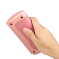 Pink plastic pet grooming brush with textured grip and rounded edges for grooming comb use