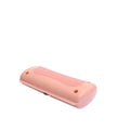 Pink plastic pet grooming comb with smooth rounded design and two small holes shown alongside black plastic pet comb