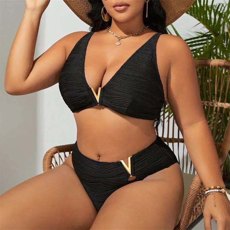 Black pleated bikini two-piece set featuring gold accents and v-shaped metal details on top and bottom