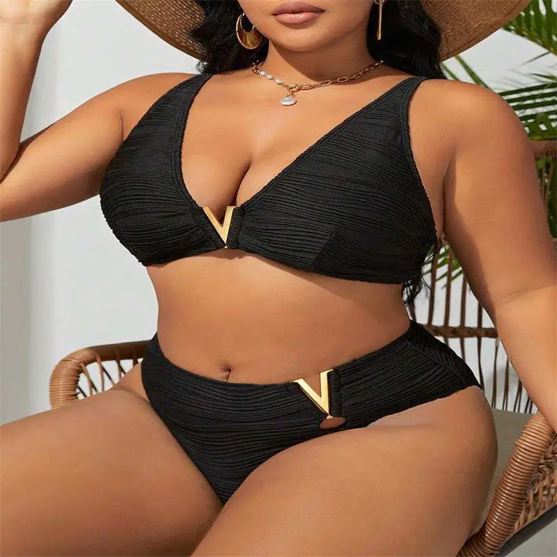 Black pleated bikini two-piece set with gold accents features v shaped metal details on top and bottom pieces