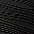 Black pleated bikini two-piece featuring dark textured fabric with subtle wavy pattern and gold accents