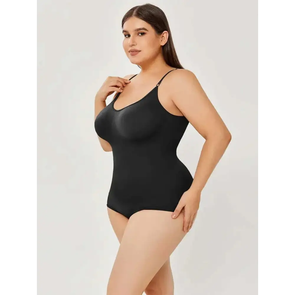 Black plus size women tummy control one-piece swimsuit with thin spaghetti straps and form-fitting design