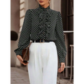 Black polka dot ruffled long sleeve shirt made of lightweight fabric featuring a ruffled front design