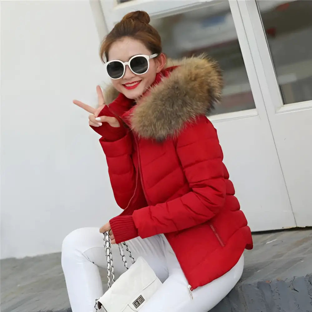 Red puffer jacket with fur-lined hood ideal for winter womens outerwear like a black quilted parka jacket