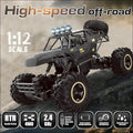 Black remote control rock crawler truck with large rugged tires and detailed chassis featuring rechargeable batteries