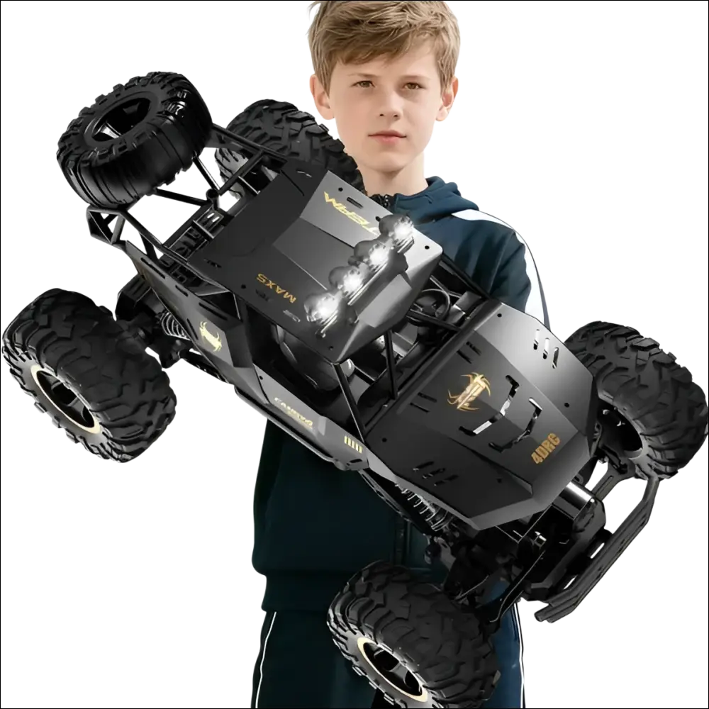 Black remote control rock crawler with rugged tires gold-accented branding and rechargeable batteries