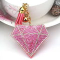Pink diamond-shaped bag pendant adorned with rhinestones and a gold-toned creative tassel for bags