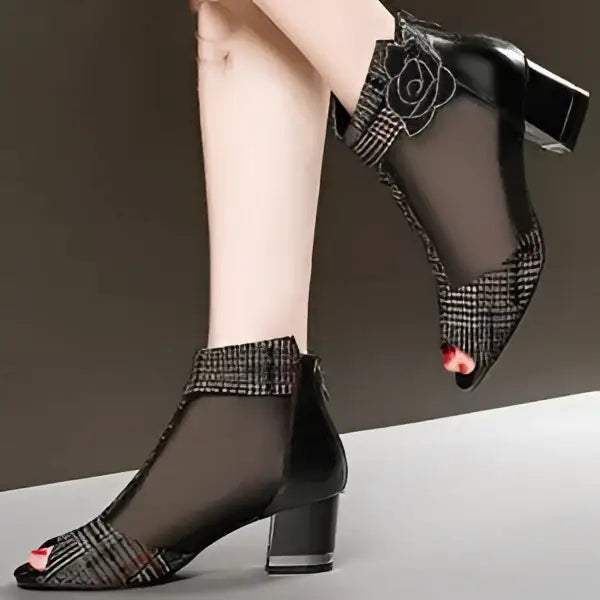 Black mesh peep-toe ankle block heel booties with floral embellishment featuring black rhinestone rose detail