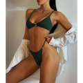 Dark green ribbed bikini set with black ribbed circular metal accents on top center and side tie details