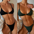 Black ribbed circular accent bikini with metal accents featuring a ribbed texture and high-cut bottoms for swimwear