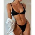 Black ribbed circular accent bikini set with thin straps and metal accents for stylish swimwear fashion