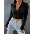 Black ribbed slim long sleeve crop top with half zip front made of ribbed fabric for a stylish fit