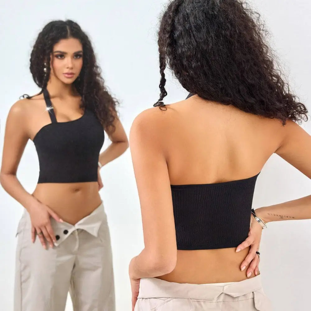 Black ribbed solid color low cut one shoulder vest featuring halter neck and back strap design in ribbed fabric
