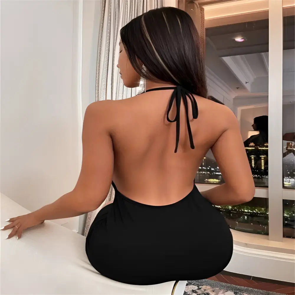 Black ruched sling backless halter dress showing the back with a temperament sling backless tie detail in black fabric