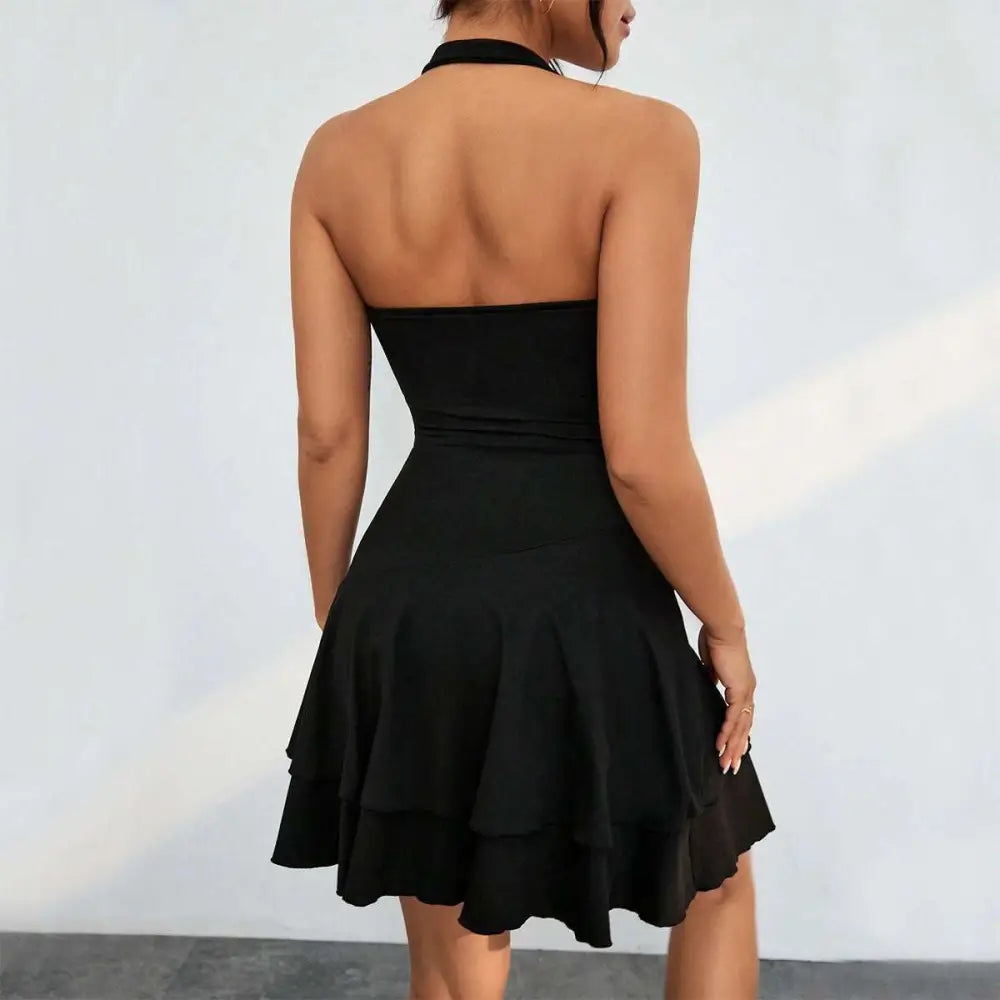 Black ruffle dress with a fitted bodice and tiered ruffle skirt is a fashion sleeveless backless choice for occasions