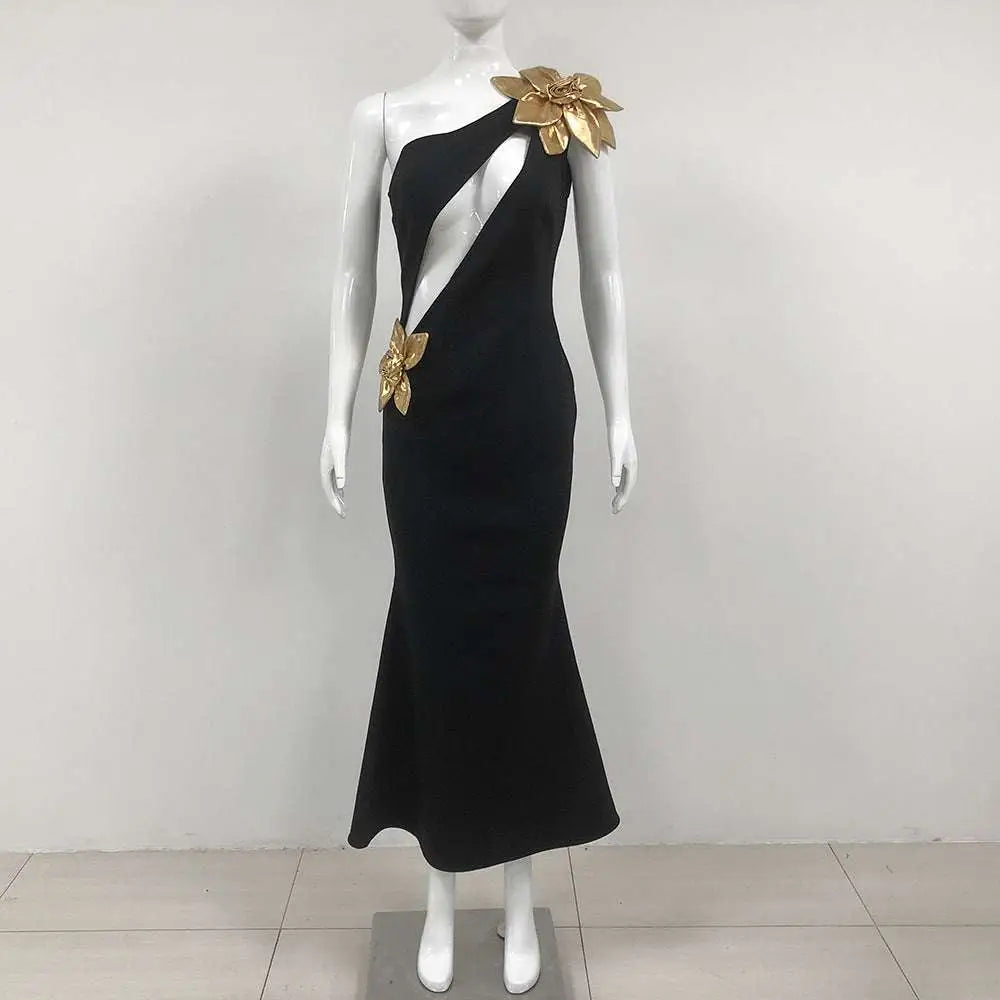 Black satin bandage flower maxi dress featuring a one-shoulder mermaid design with gold metallic floral embellishments
