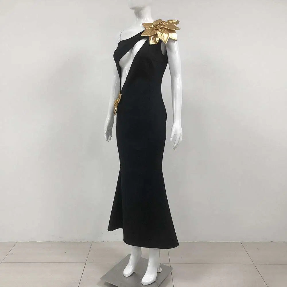 Black satin bandage flower maxi dress featuring a one-shoulder mermaid silhouette with gold leaf embellishments