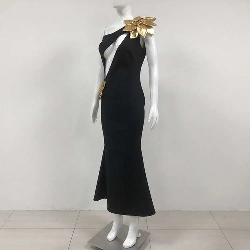 Black satin bandage flower maxi dress featuring a one-shoulder mermaid silhouette with gold leaf embellishments