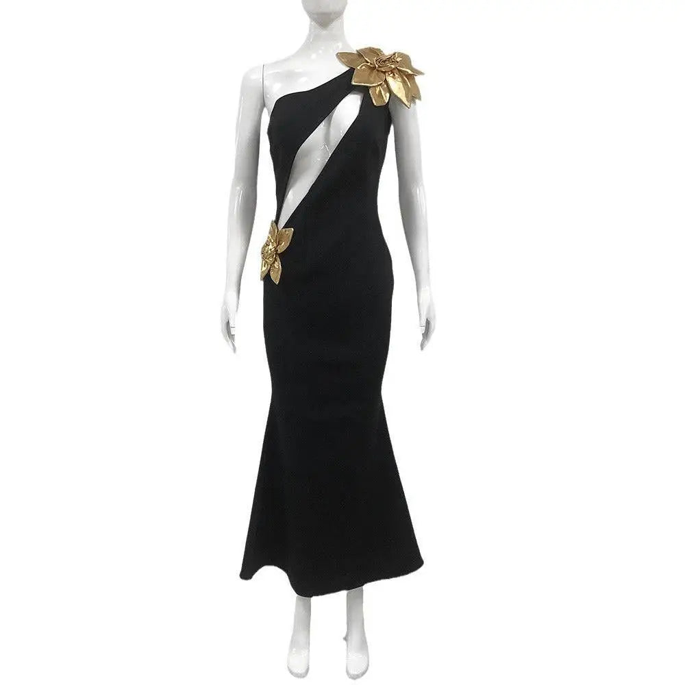 Black satin bandage flower maxi dress featuring a one-shoulder mermaid gown with gold floral embellishments