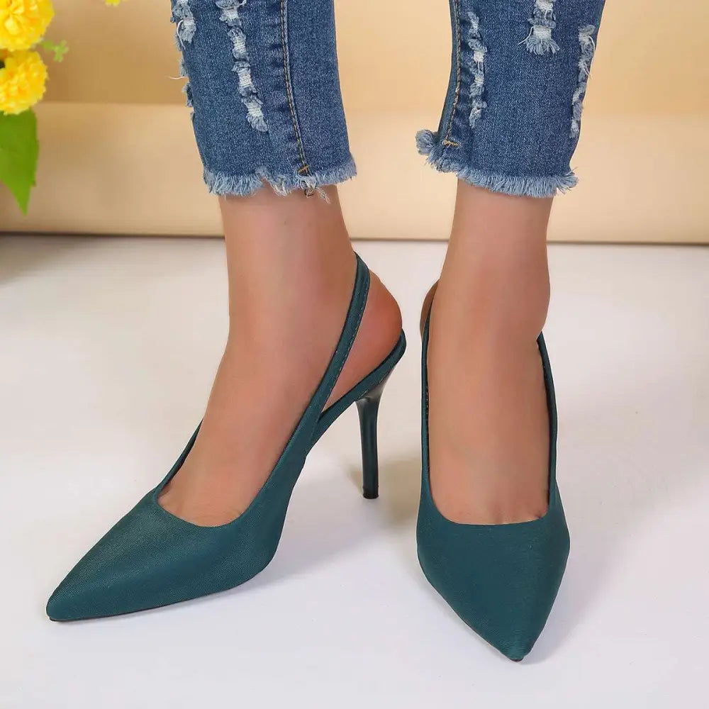 Teal suede high heel sandals with slender black heel styled as black satin high heel sandals closed toe design