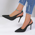 Black satin high heel sandals with a sleek pointed toe and thin suede high heel slingback design
