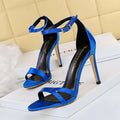 Vibrant blue satin high heel sandals with sleek straps, ankle strap, silver buckle, and heel toe cutout design