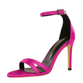 A vibrant fuchsia satin high heel sandal with slender heel and ankle strap featuring heel toe cutout design