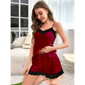 A deep red satin pajama set with black lace trim on the neckline and hem for women’s suspender shorts casual summer suit