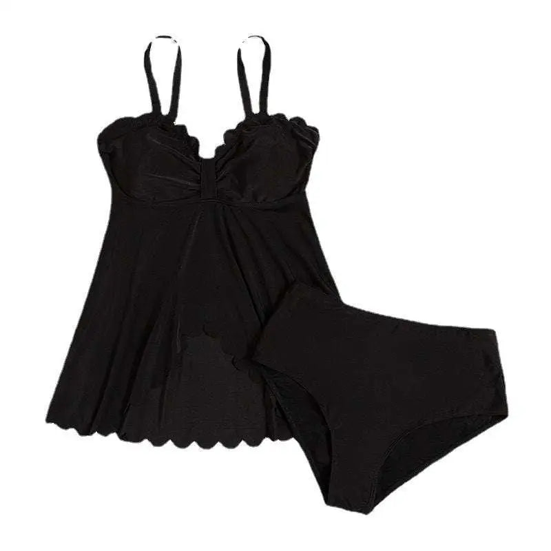 Black scalloped plus size bottoms two piece set featuring a ruffled top and scalloped hemline in black fabric