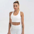 White seamless women’s shockproof running sports bra with racerback straps and breathable fabric for high impact workouts