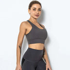 A sleek dark gray seamless women’s shockproof running sports bra with racerback design for high-impact support