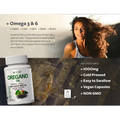 White plastic bottle of wxx black seed oil with black seed oil capsules for natural wellness supplement use