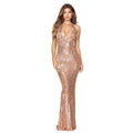 A shimmering rose gold sequined halter backless dress with deep v halter and mermaid silhouette