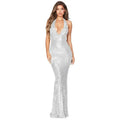 A shimmering silver sequined halter backless dress with a deep v halter and mermaid silhouette